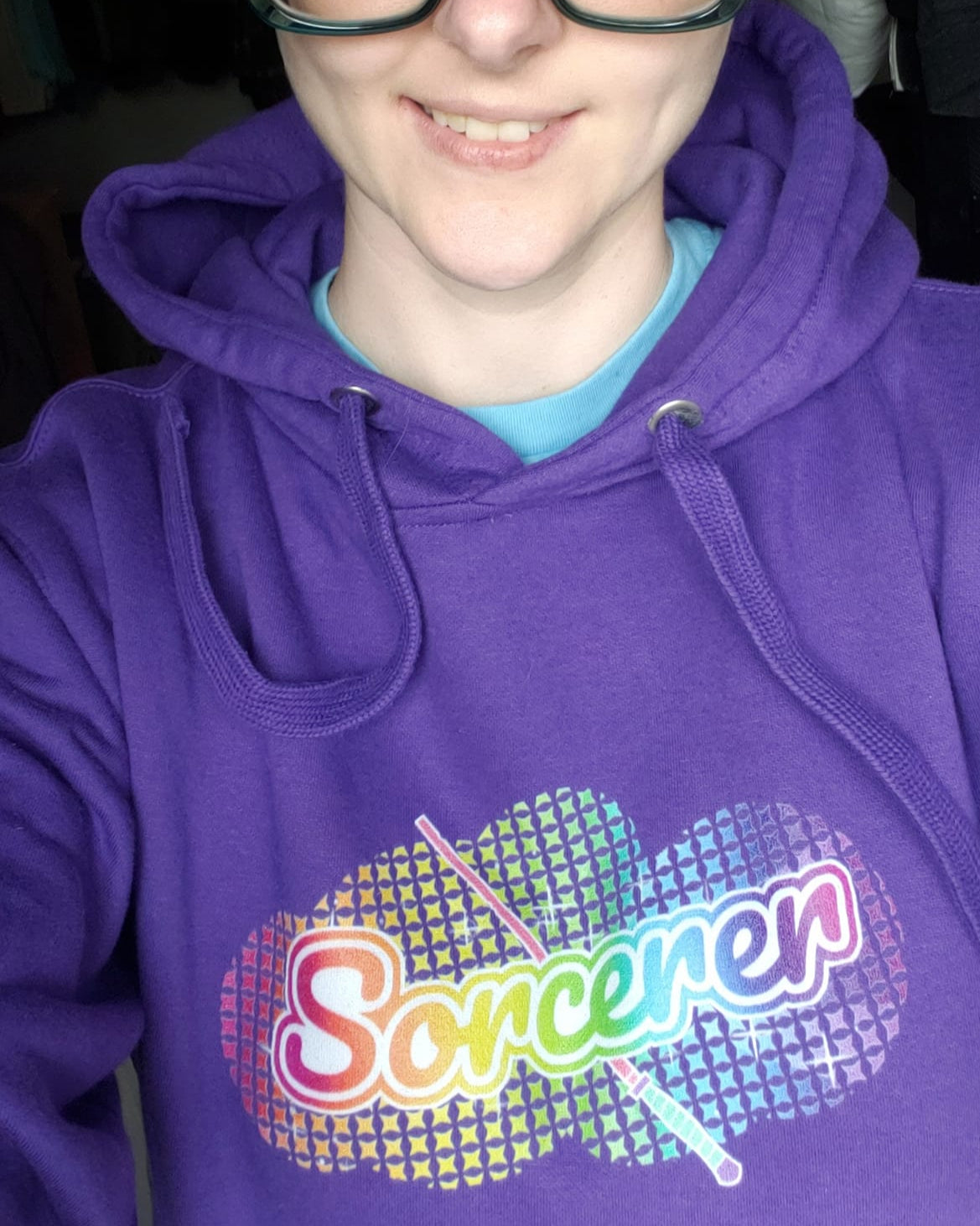 Model in Purple "Sorcerer" hoodie