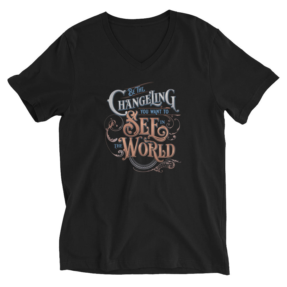 Black V-Neck unisex tee with design  “Be the Changeling you want to see in the world” in silver, bronze and blue lettering surrounded by intricate decals