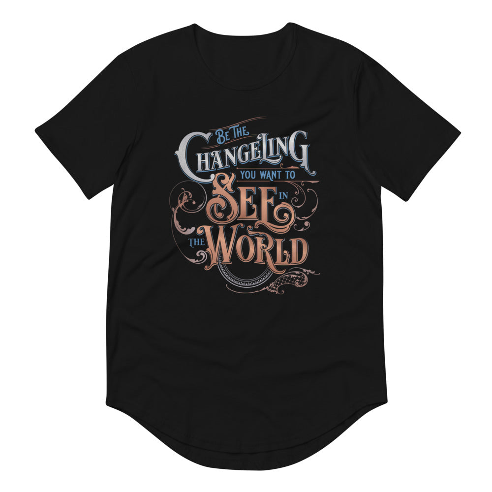 Black masc fit curved hem Tee with “Be the Changeling you want to see in the world” in silver, bronze and blue lettering surrounded by intricate decals