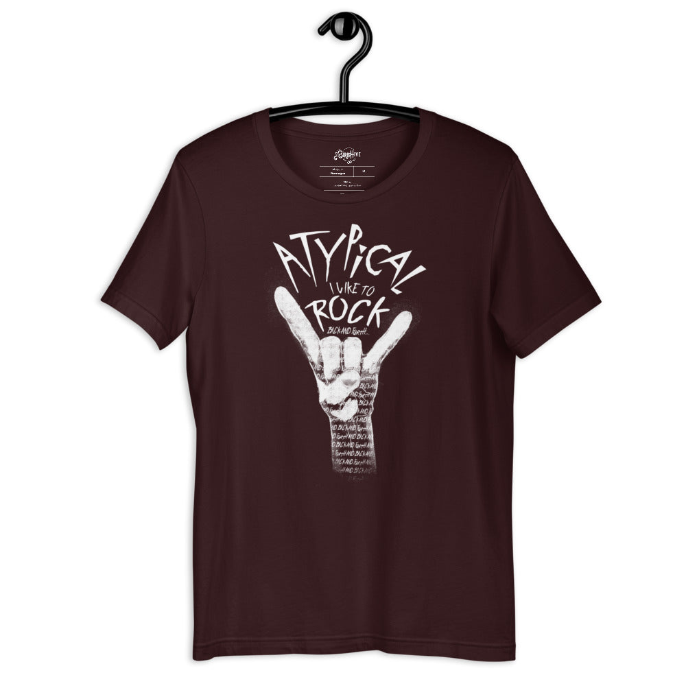 Oxblood unisex fit tee with design “Atypical, I like to ROCK” in smaller font “back and forth”. Painting of a white hand making the ROCK symbol. Inside the shading of the hand words continue saying “back and forth and back and forth and back and forth…” repeated.