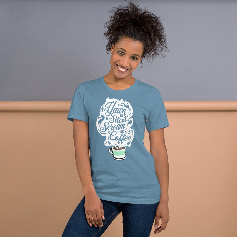 Model of black woman with 3a style curls in Steel Blue (light blue) Unisex fit Tee with White coffee cup with green stripe filled with hot coffee that is releasing white steam. "A Yawn is a Silent Scream for Coffee" written in the steam. 