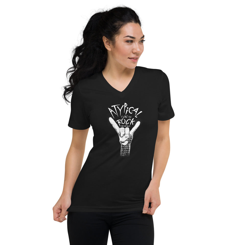 Model of white woman with wavy dark hair and slender build wearing the black unisex fit V-Neck which has a more curve hugging fit. The design is “Atypical, I like to ROCK” in smaller font “back and forth”. Painting of a white hand making the ROCK symbol. Inside the shading of the hand words continue saying “back and forth and back and forth and back and forth…” repeated.