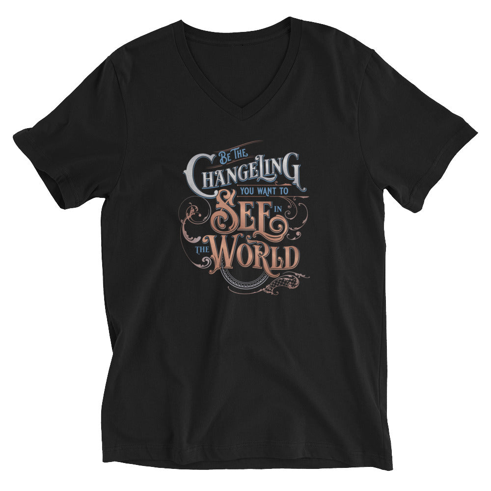 Black V-Neck unisex tee with design  “Be the Changeling you want to see in the world” in silver, bronze and blue lettering surrounded by intricate decals